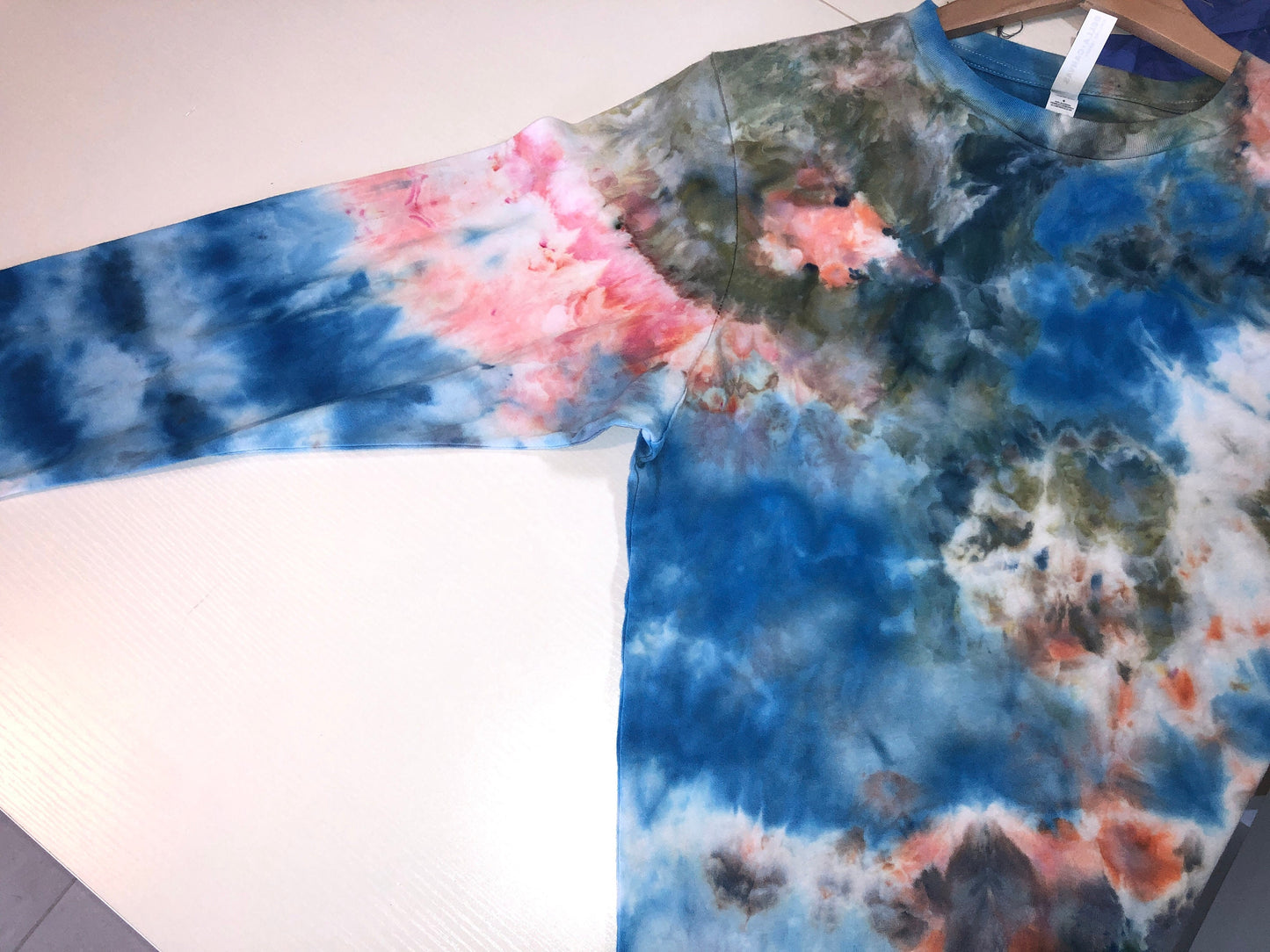 Long sleeve ice dyed t-shirt. Blue, green, peach