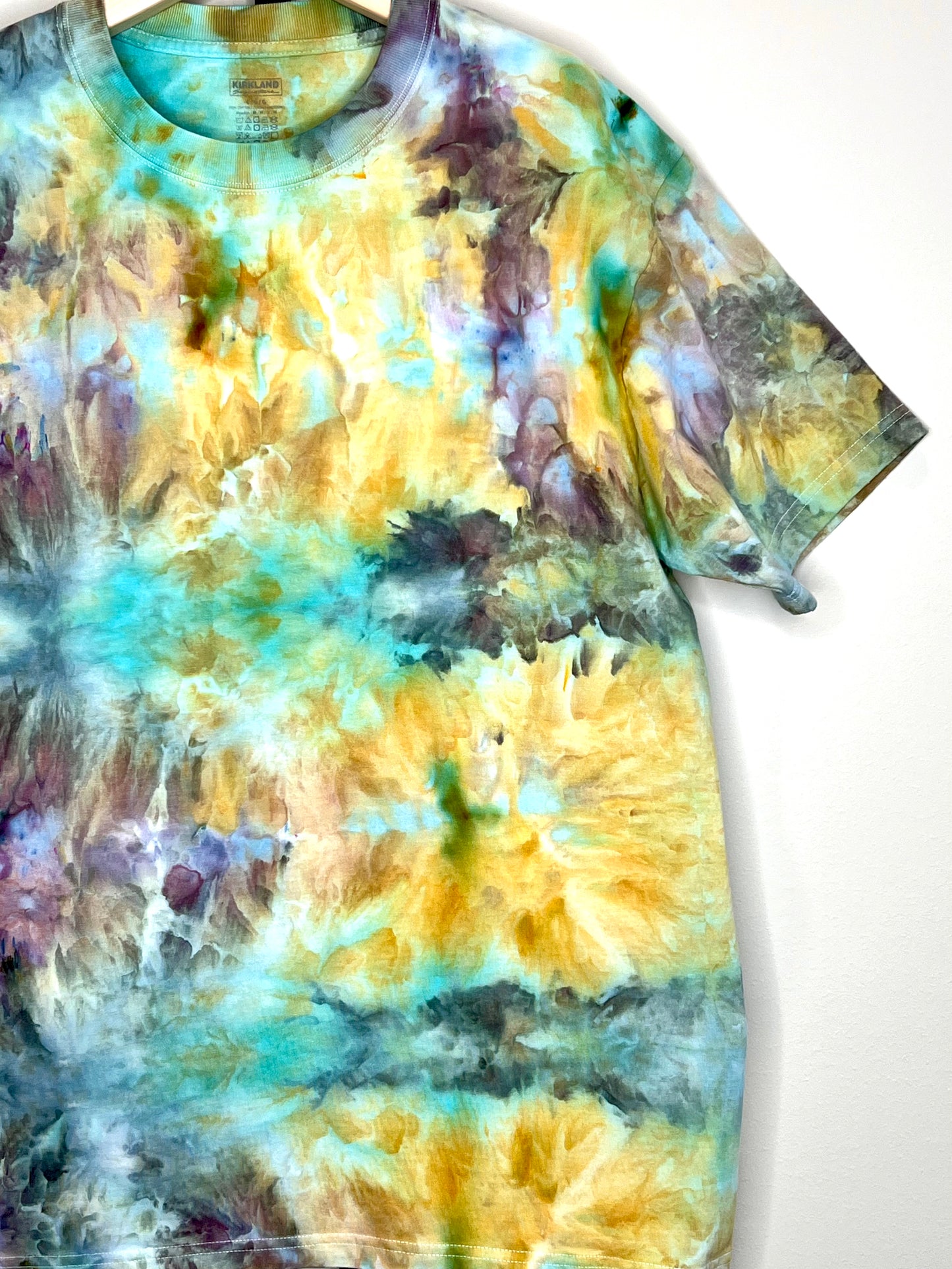 Reimagined peacock ice dyed short sleeve unisex shirt. Large