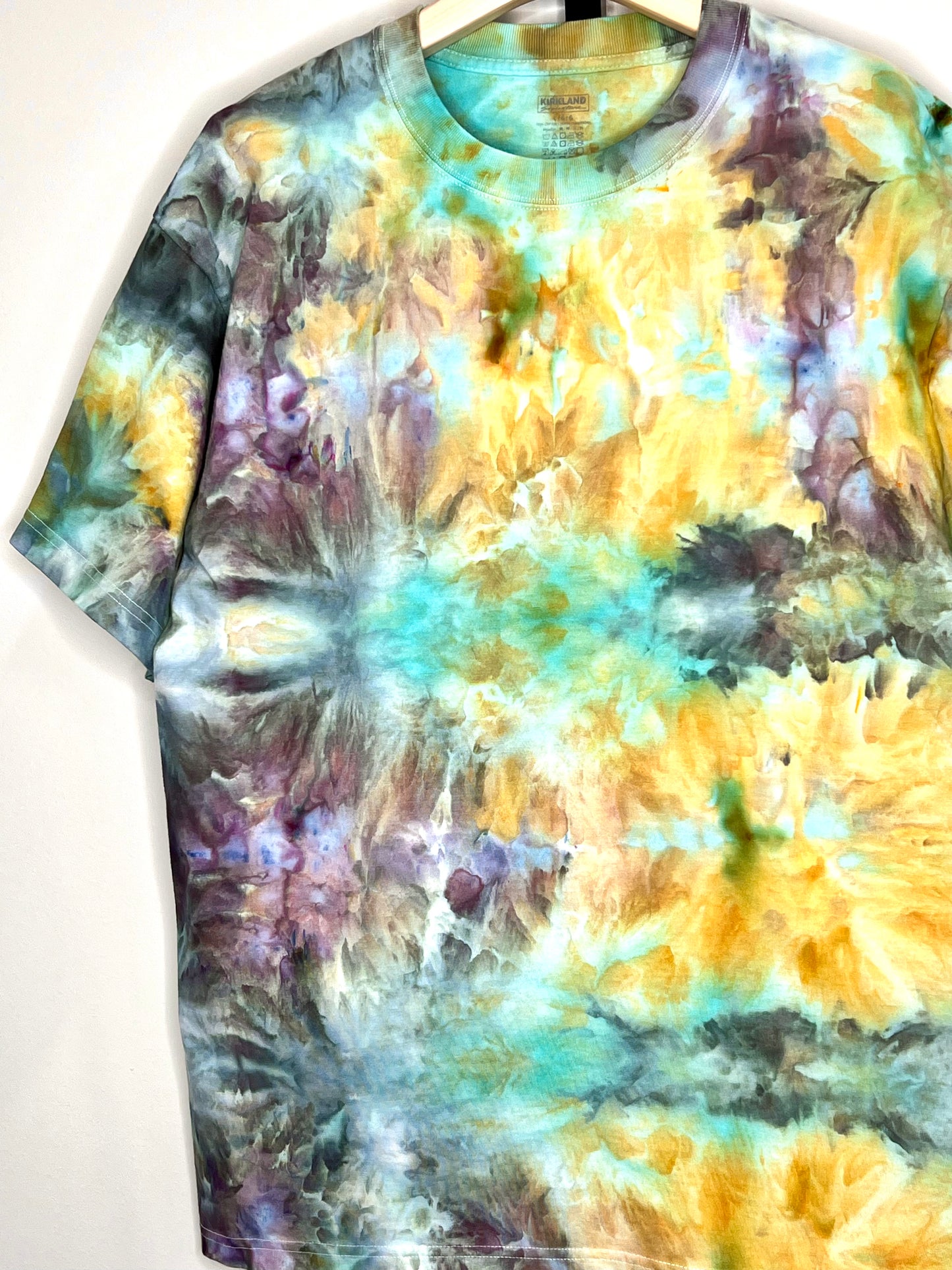 Reimagined peacock ice dyed short sleeve unisex shirt. Large