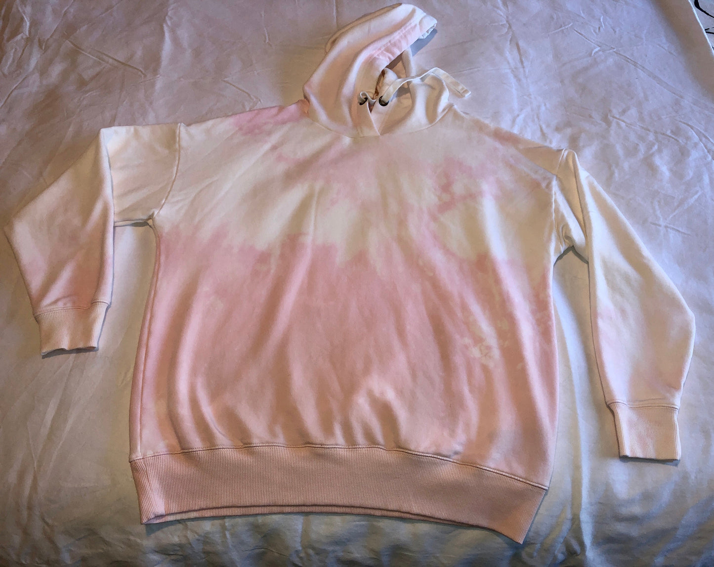 Pink/ white reverse tie dye hooded sweatshirt